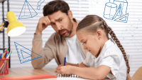 Vater lernt mit seiner Tochter am Schreibtisch für den Geometrieunterricht