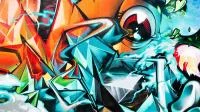 Graffito mit Schriftzeichen und Auge