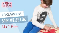 Abbildung Junge spielt LÜK
